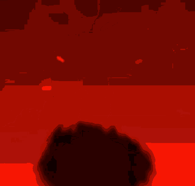 a silhouette of a person with red eyes and a green background