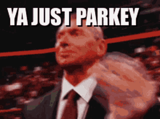 a man in a suit and tie giving the middle finger with the words ya just parkey