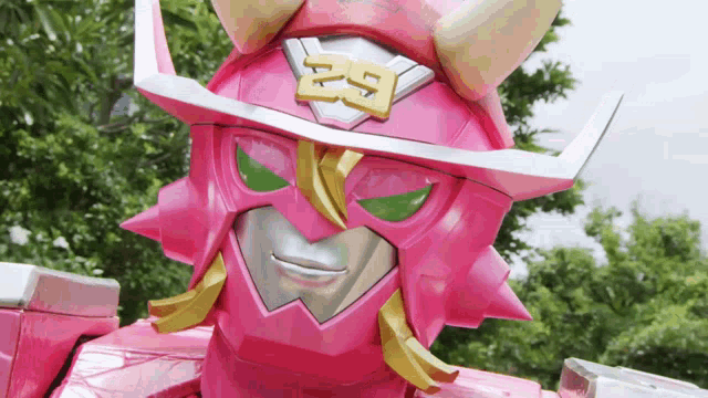 a pink robot with the number 29 on it