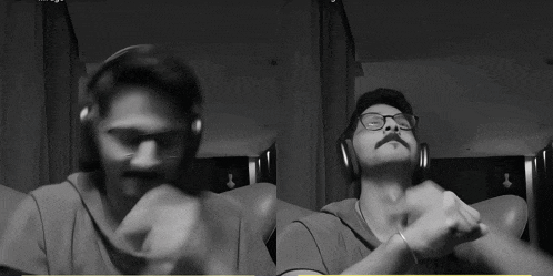 a man wearing headphones and glasses is dancing