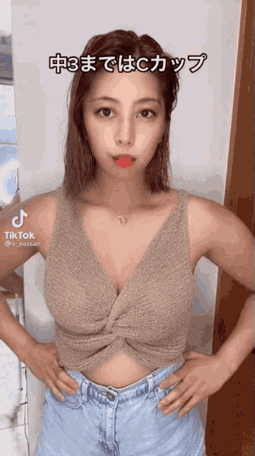 a woman wearing a crop top and shorts has tiktok written on the bottom right