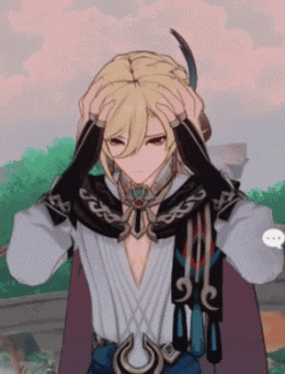 a man with blonde hair is holding his head with his hands