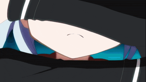 a close up of a person 's face with a black hoodie on