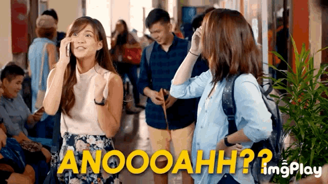 a woman talking on a cell phone next to a sign that says anoooahhh ?