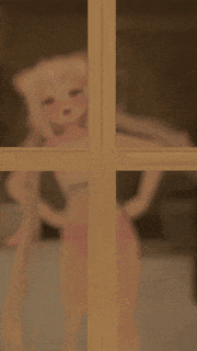 a blurred image of a child behind a glass door