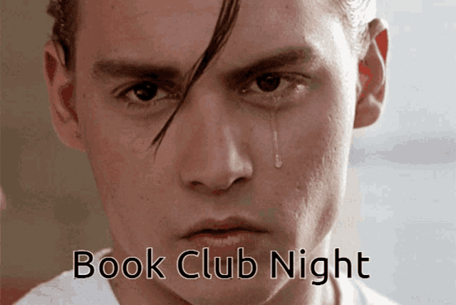 a close up of a man 's face with a tear coming out of his eye that says book club night