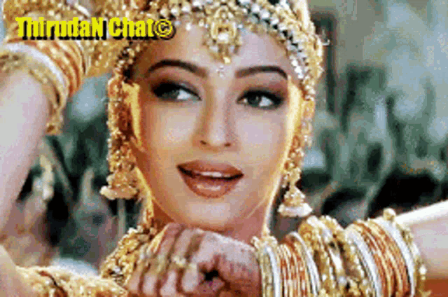 a woman with a lot of gold jewelry is smiling with the words thrudan chat on the bottom