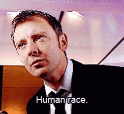 a man in a suit and tie is saying human face