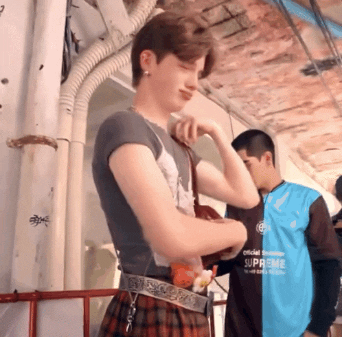 a man in a blue shirt that says supreme