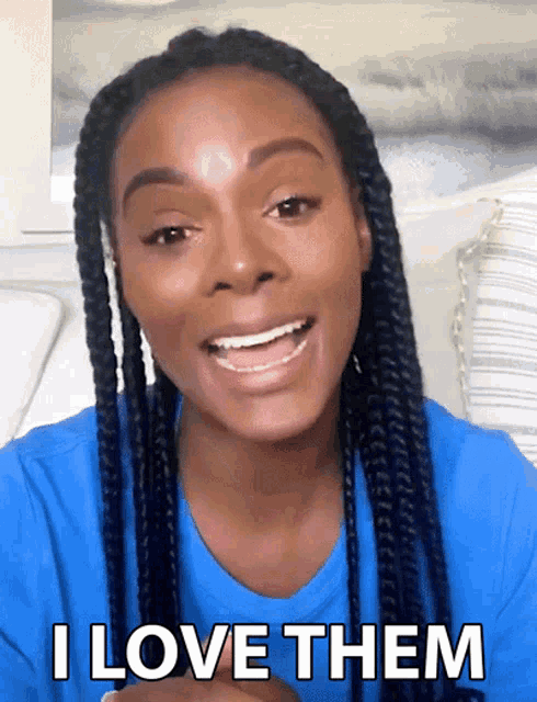 a woman with braids is smiling and says i love them