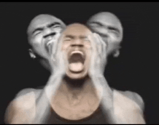 a man is screaming with two faces behind his head