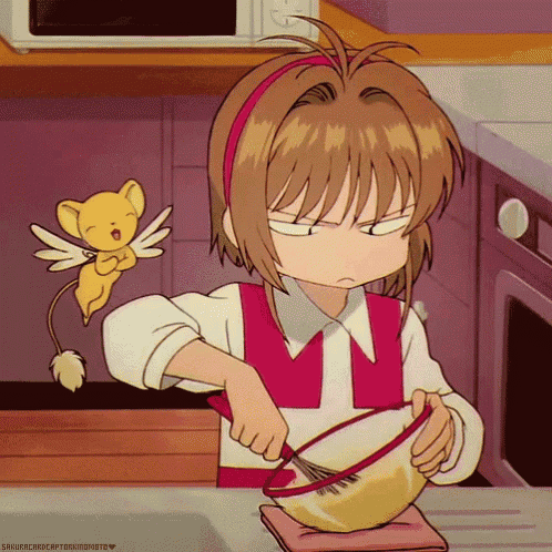 a girl is mixing something in a bowl with a whisk while a cartoon character looks on