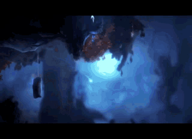 a video game scene with a blue light shining through trees