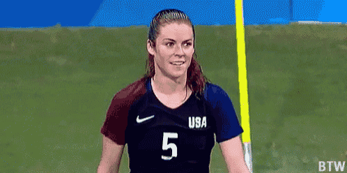 a female soccer player wearing a jersey with the number 5 on it