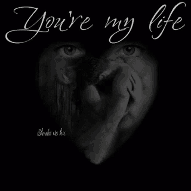 a black and white photo of a man and a woman in a heart shaped frame .