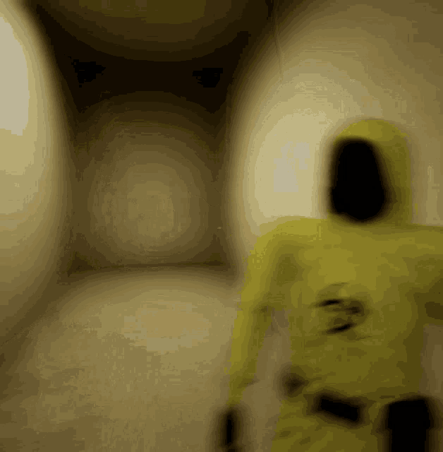a blurry picture of a person in a yellow suit with the number 3 on their back