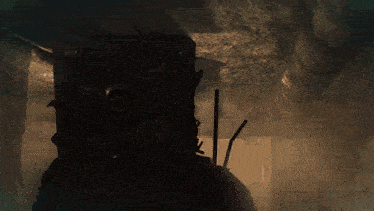 a close up of a person 's head with a red helmet on it