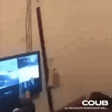 a person is sitting in front of a television with a coub logo on the bottom right