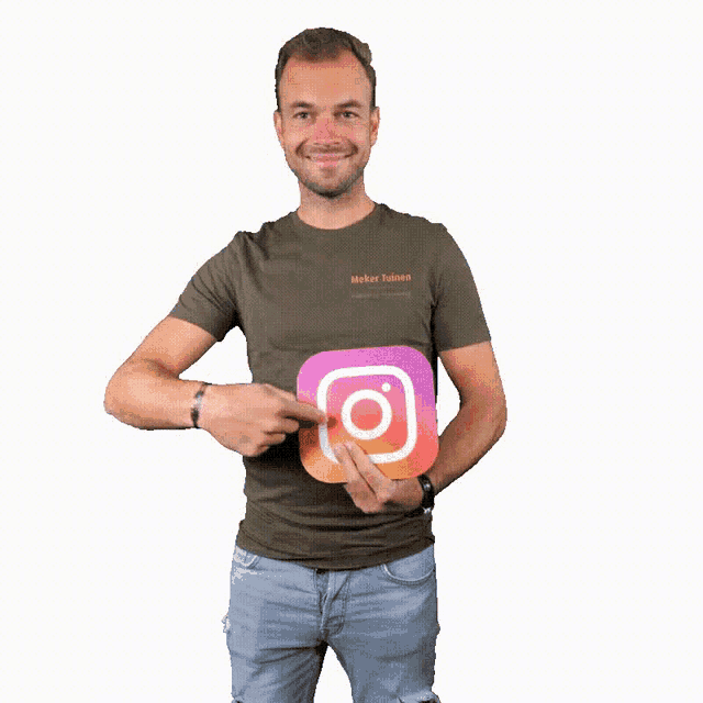 a man in a maker t-shirt holds an instagram icon