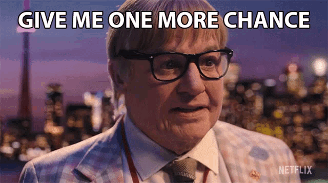 a man with glasses and a suit says give me one more chance