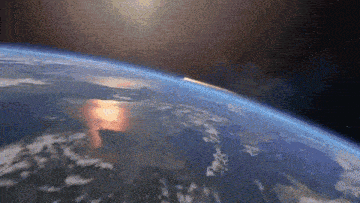 a view of the earth from space with the sun shining through it