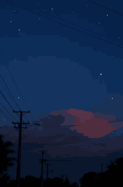 a shooting star is visible in the night sky above the telephone poles