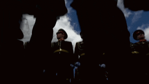 a blurry picture of a group of soldiers standing in a line