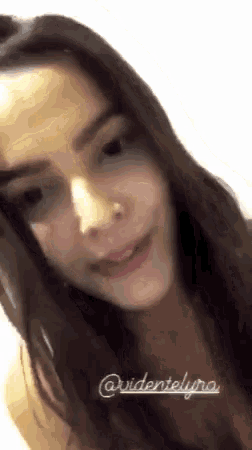 a close up of a woman 's face with the words ' @videnielyna ' on the bottom