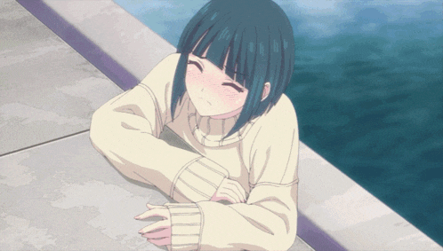 a girl in a white sweater laying on the ground