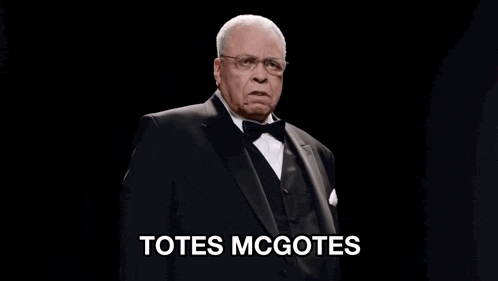 a man in a tuxedo says totes mcgotes in white letters