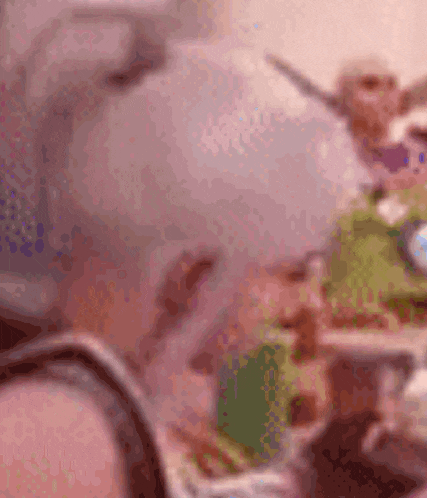 a blurred image of a person holding a knife