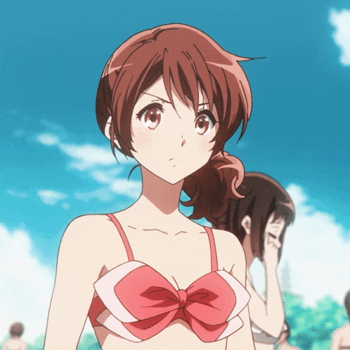 a girl in a red bikini with a bow on the top