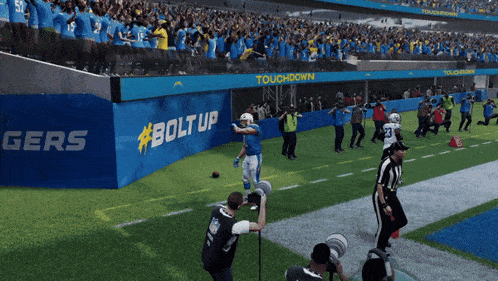 a football field with a sign that says touchdown #boltup