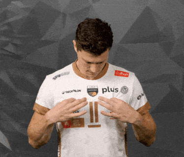 a man is wearing a white shirt with the word plus on it