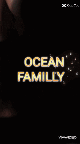 a woman with pink hair is holding a camera and the words ocean family are displayed