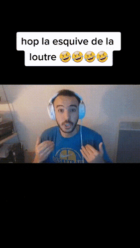 a man wearing headphones and a blue shirt that says basketball on it
