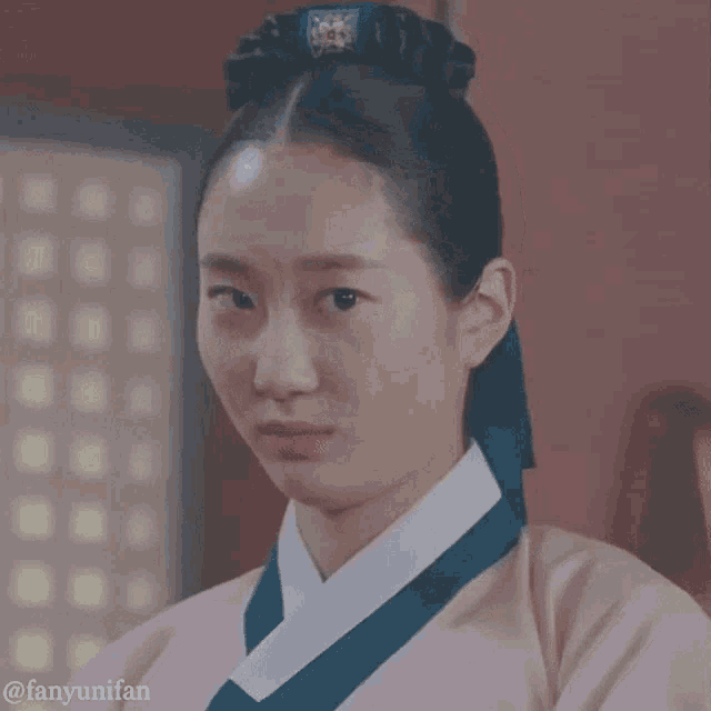 a close up of a woman 's face with the hashtag fanyunifan on the bottom