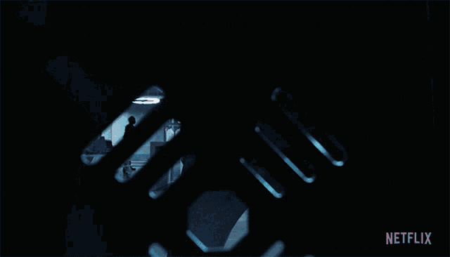 a netflix ad shows a man walking through a dark room