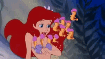 ariel from the little mermaid is surrounded by seahorses and bubbles .