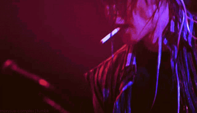 a blurry picture of a person with a purple background and the words marysue.com tumblr at the bottom
