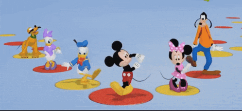 a group of mickey mouse cartoon characters are dancing