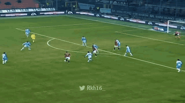 a soccer field with advertisements for tim and ea on the walls