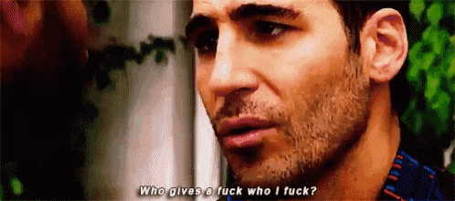 a man with a beard is talking to another man and says `` who gives a fuck who i fuck '' .
