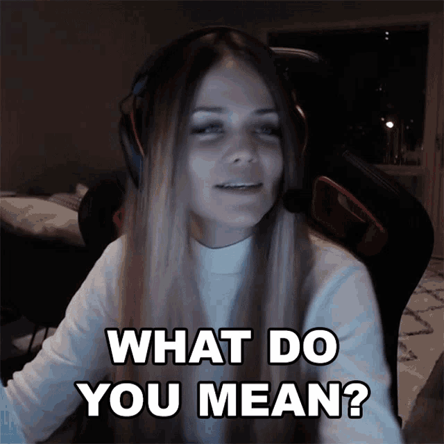 a woman wearing headphones and a headset says what do you mean
