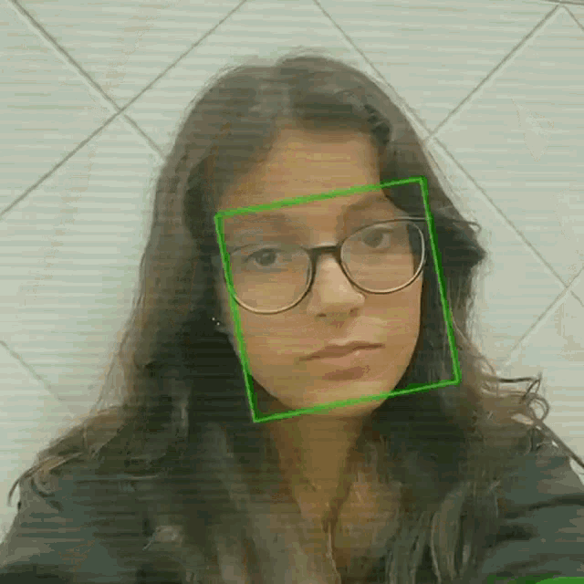 a girl with glasses and a green square around her face