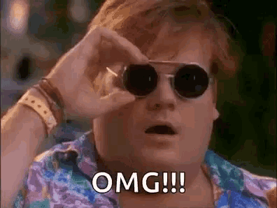 a man wearing sunglasses is looking through a pair of binoculars and saying `` omg ! ''