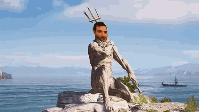 a statue of a man with a trident on his head in front of the ocean