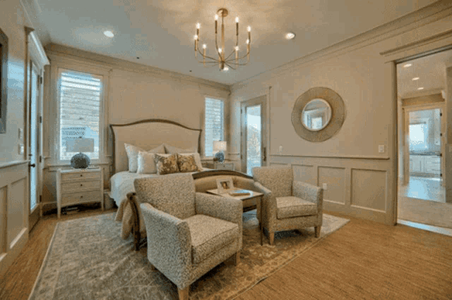 a dining room with a table and chairs in front of a door that says gym