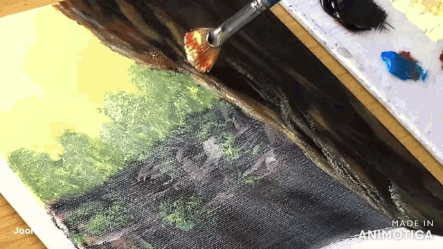a painting is being painted with a brush and the words made in animatica are on the bottom