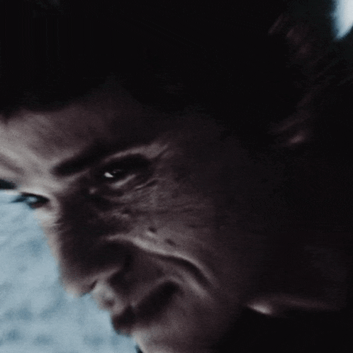 a close up of a man 's face with the words " too long " on the bottom